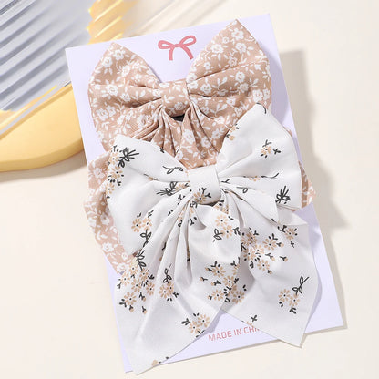 2Pcs / clipes de cabelo de arco clássico Bebé férias