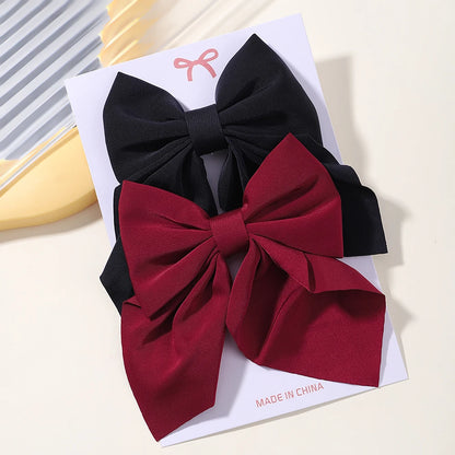 2Pcs / clipes de cabelo de arco clássico Bebé férias